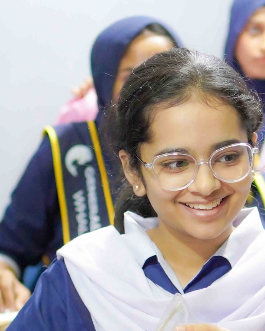 A smiling Whales College student during a university information session